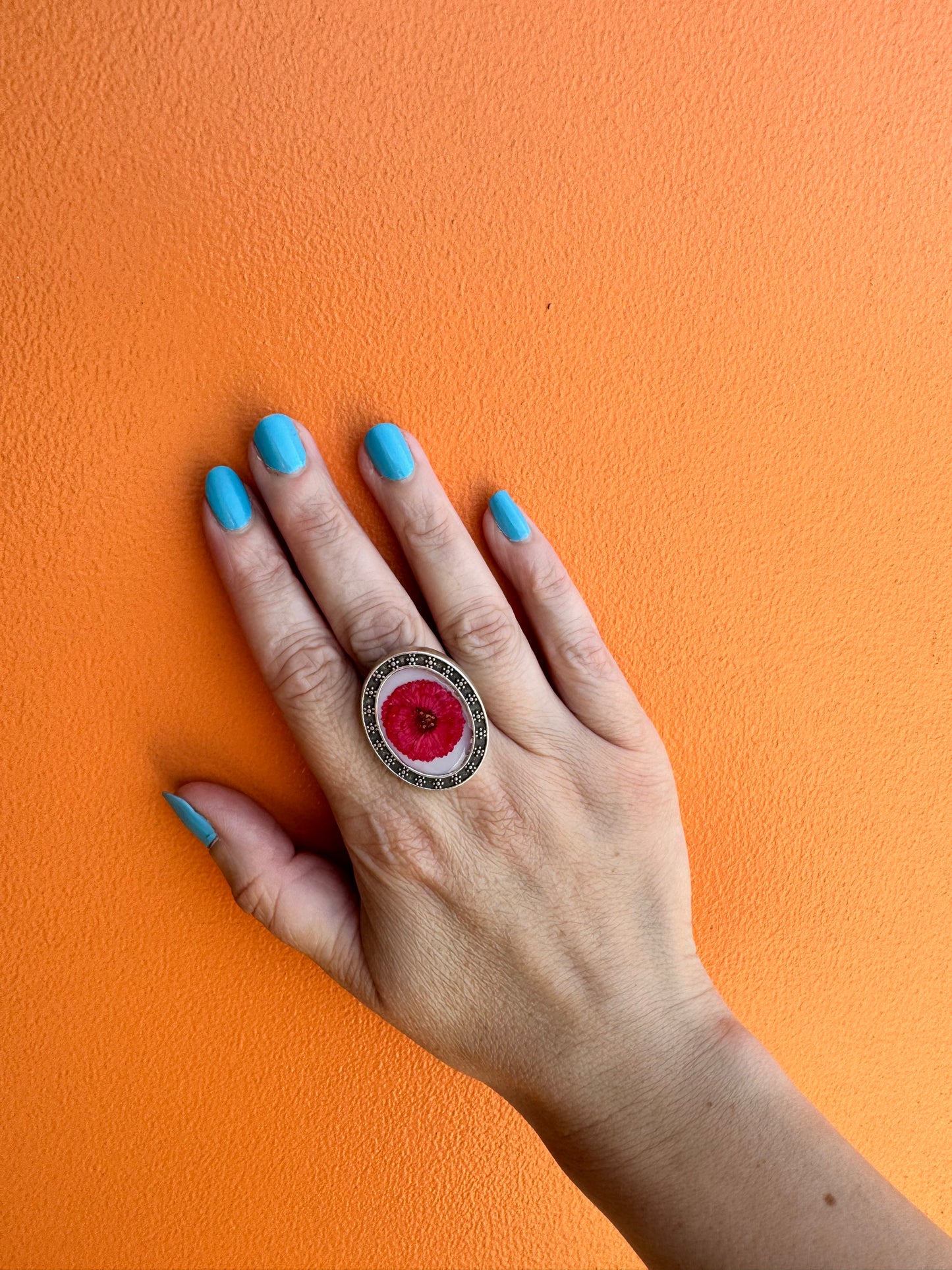 Oval silver plated ring with red flower