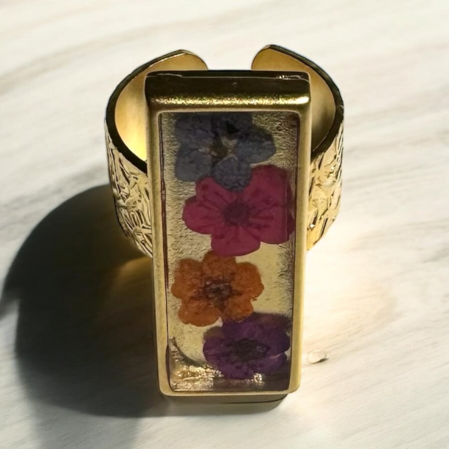 Rectangular gold plated ring with 4 flowers