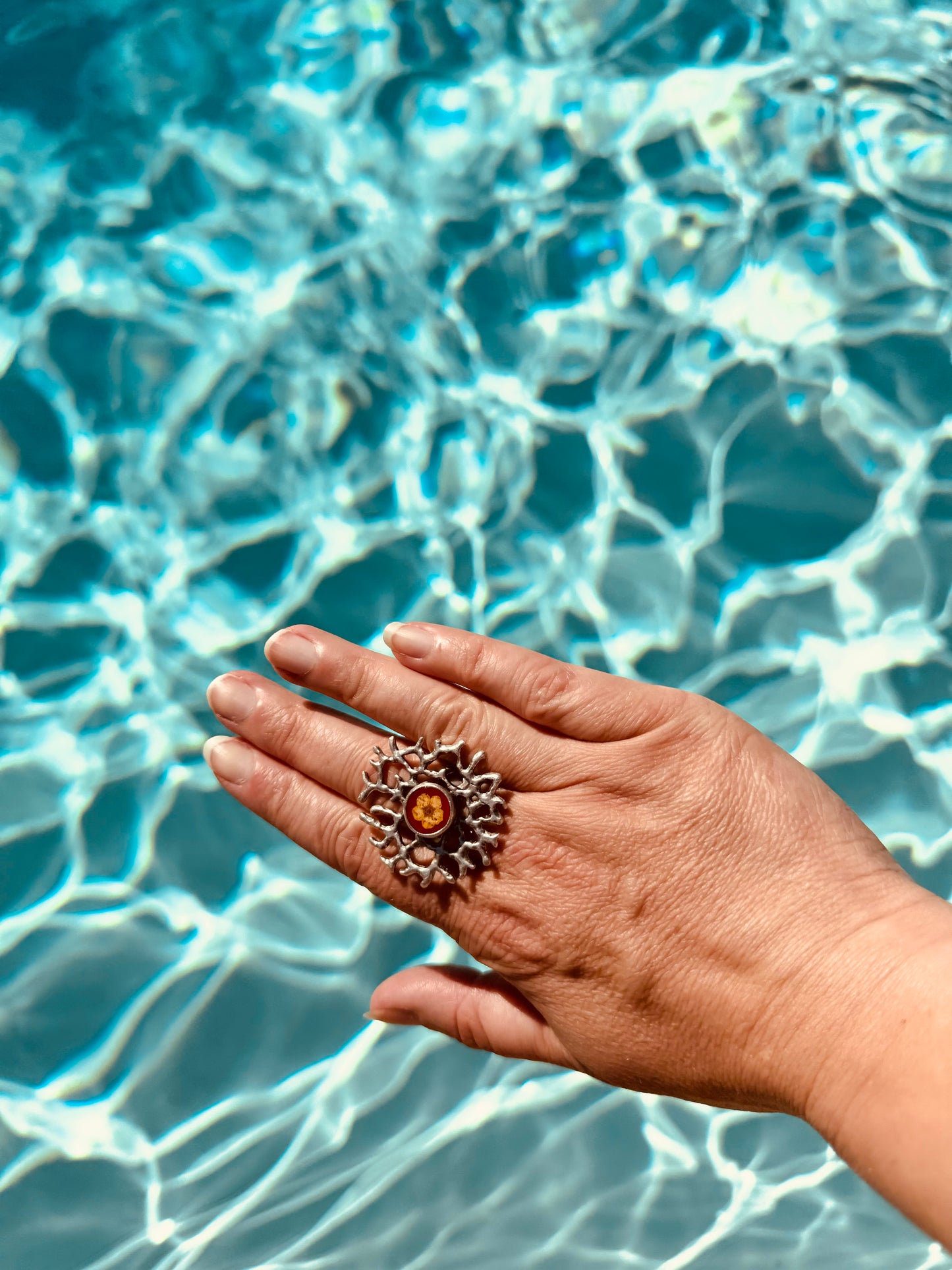 Coral ring with yellow flower