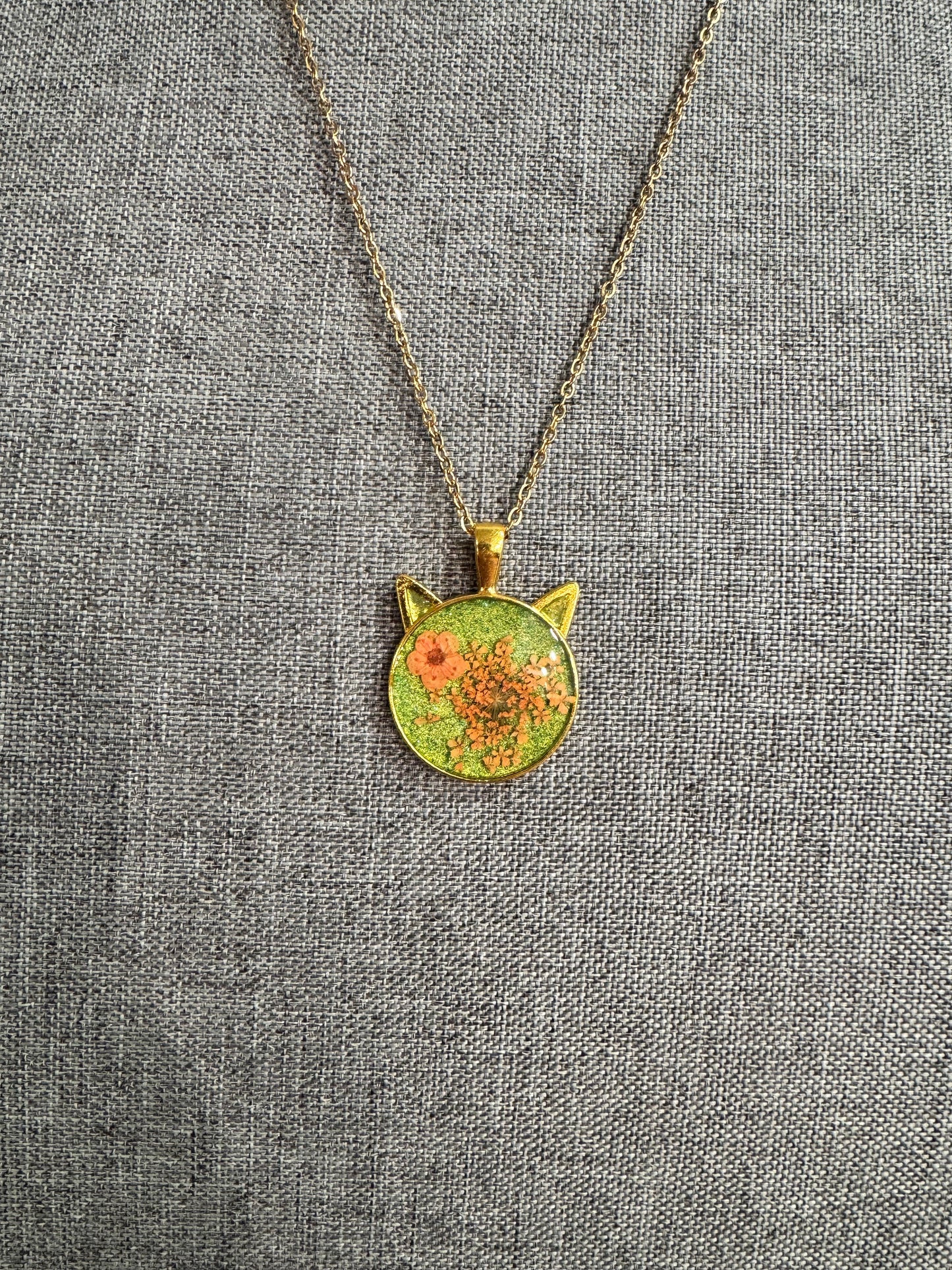 Cat head necklace with orange flowers
