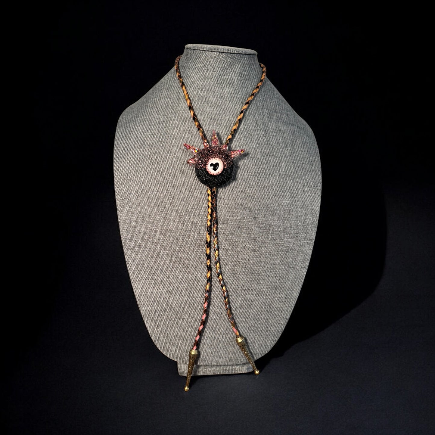 Bolo tie, black and pink monster bolo necktie. Model Spiky.