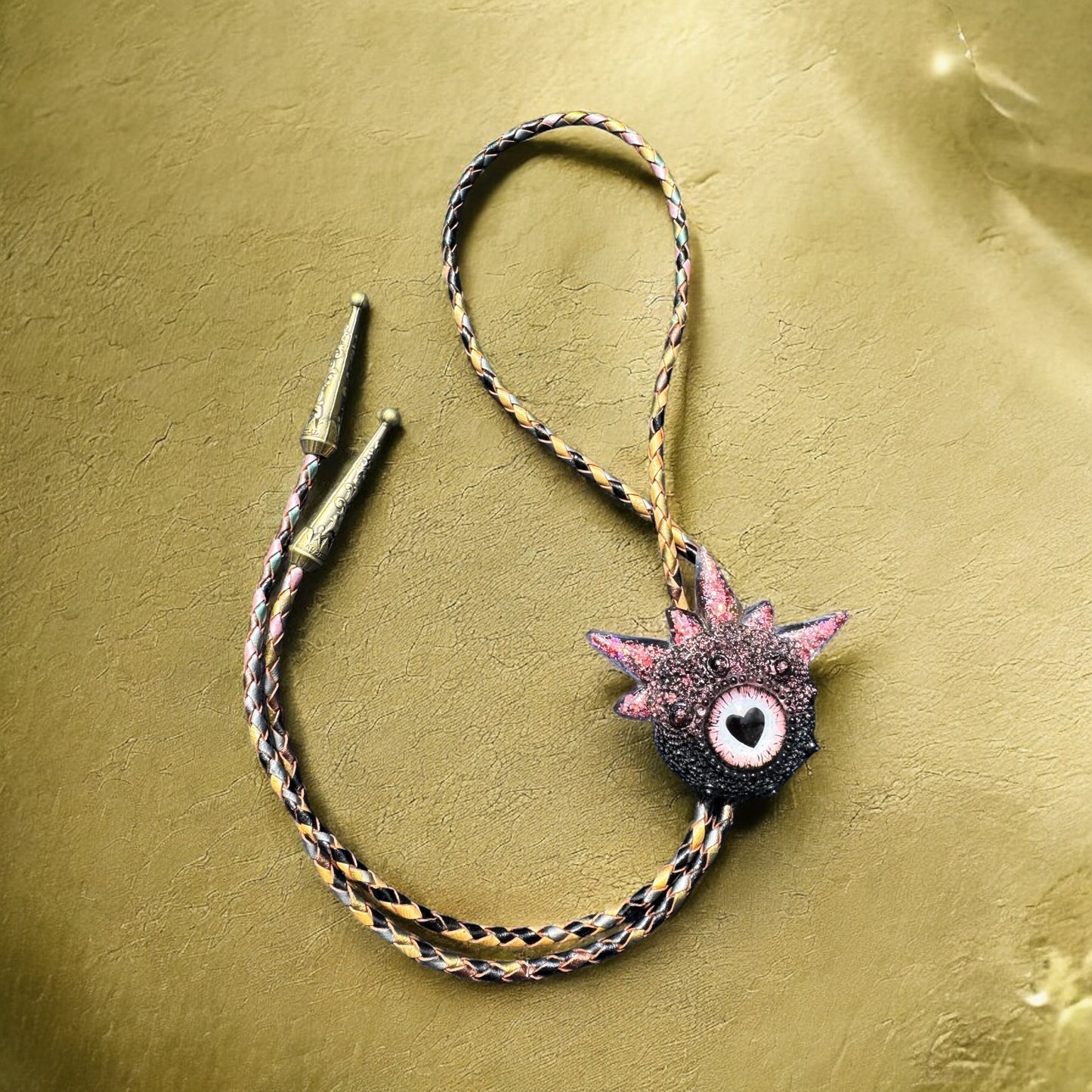 Bolo tie, black and pink monster bolo necktie. Model Spiky.