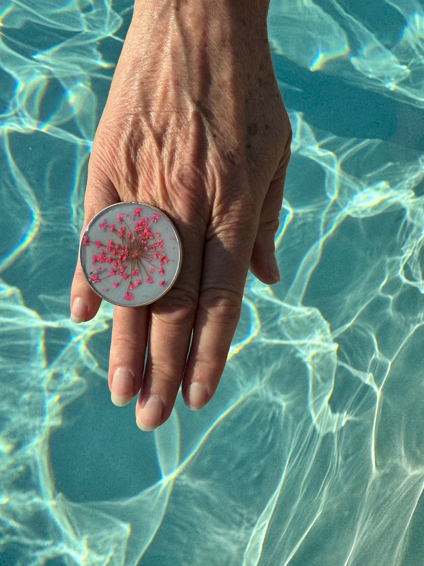 Large round ring with pink flowers