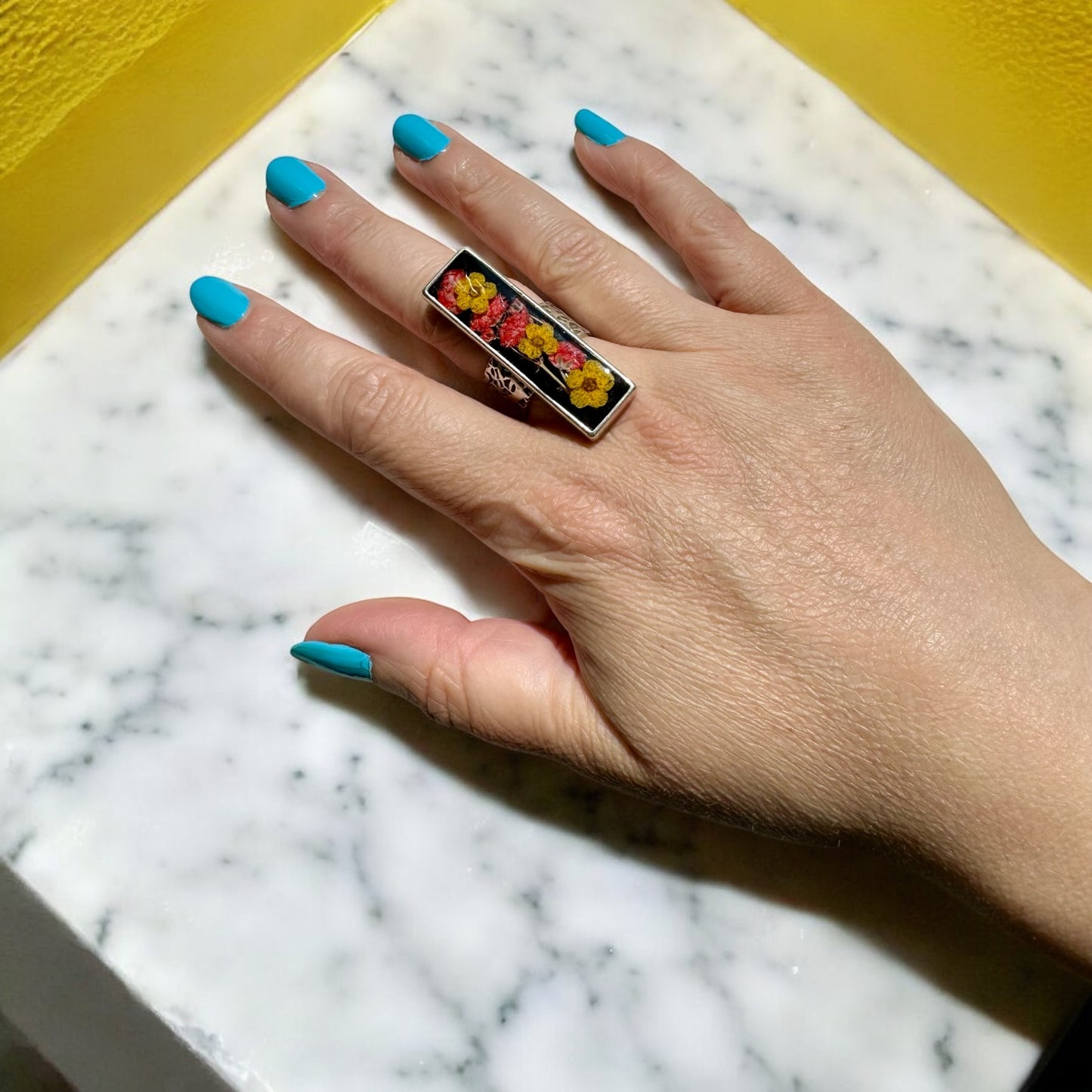 Rectangular long silver ring with flowers