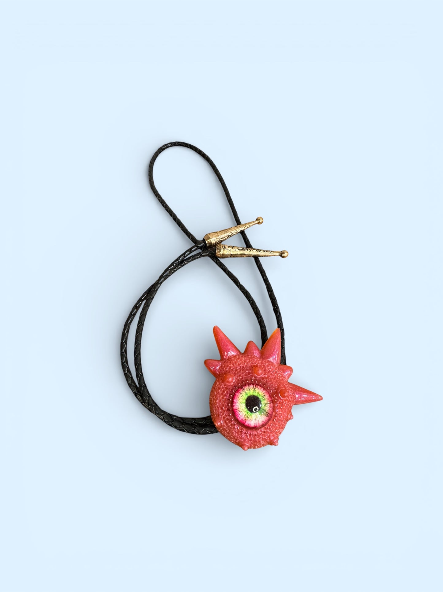 Monster bolo tie in pink. Model Spiky.
