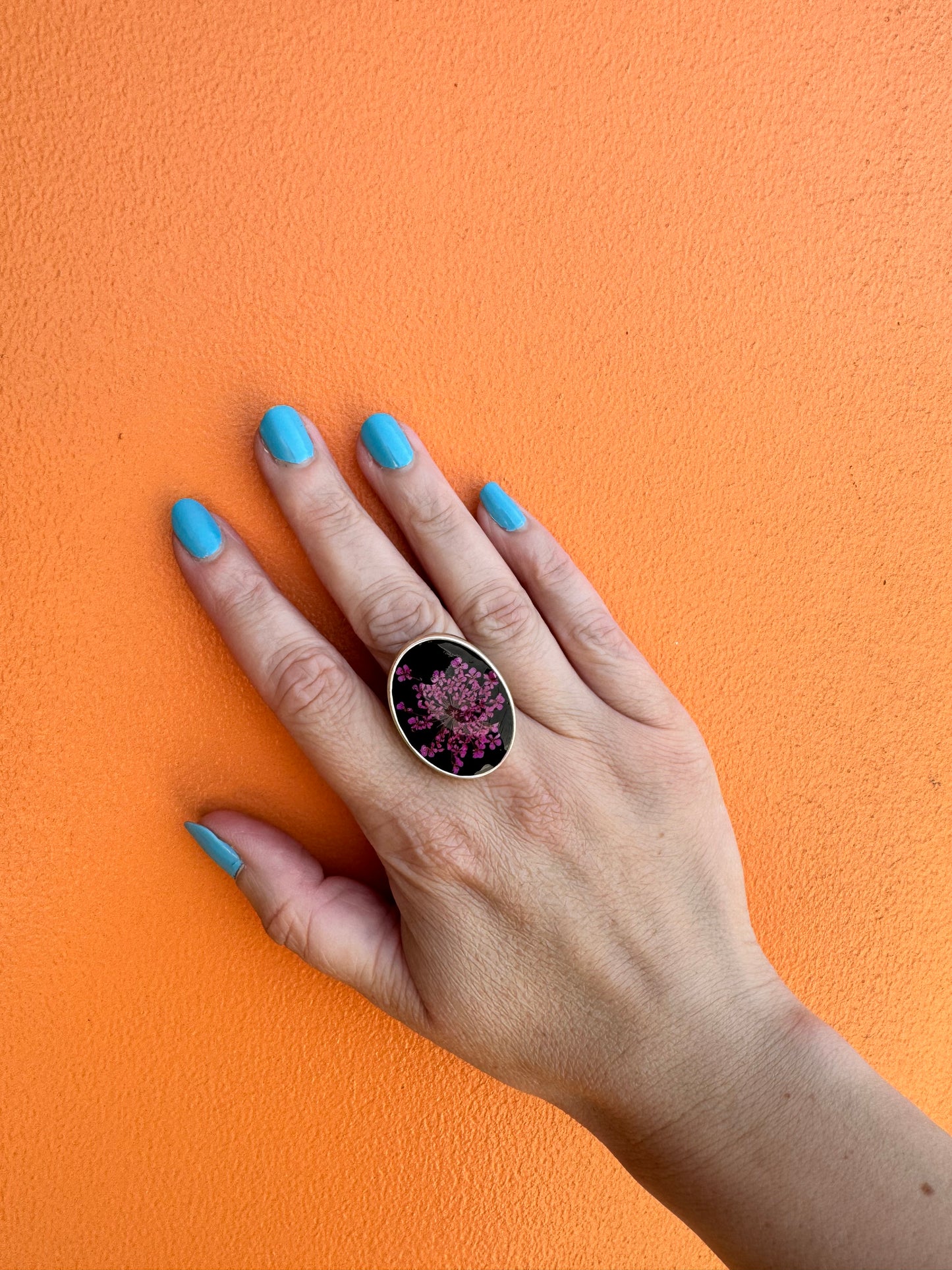 Oval ring with pink flower