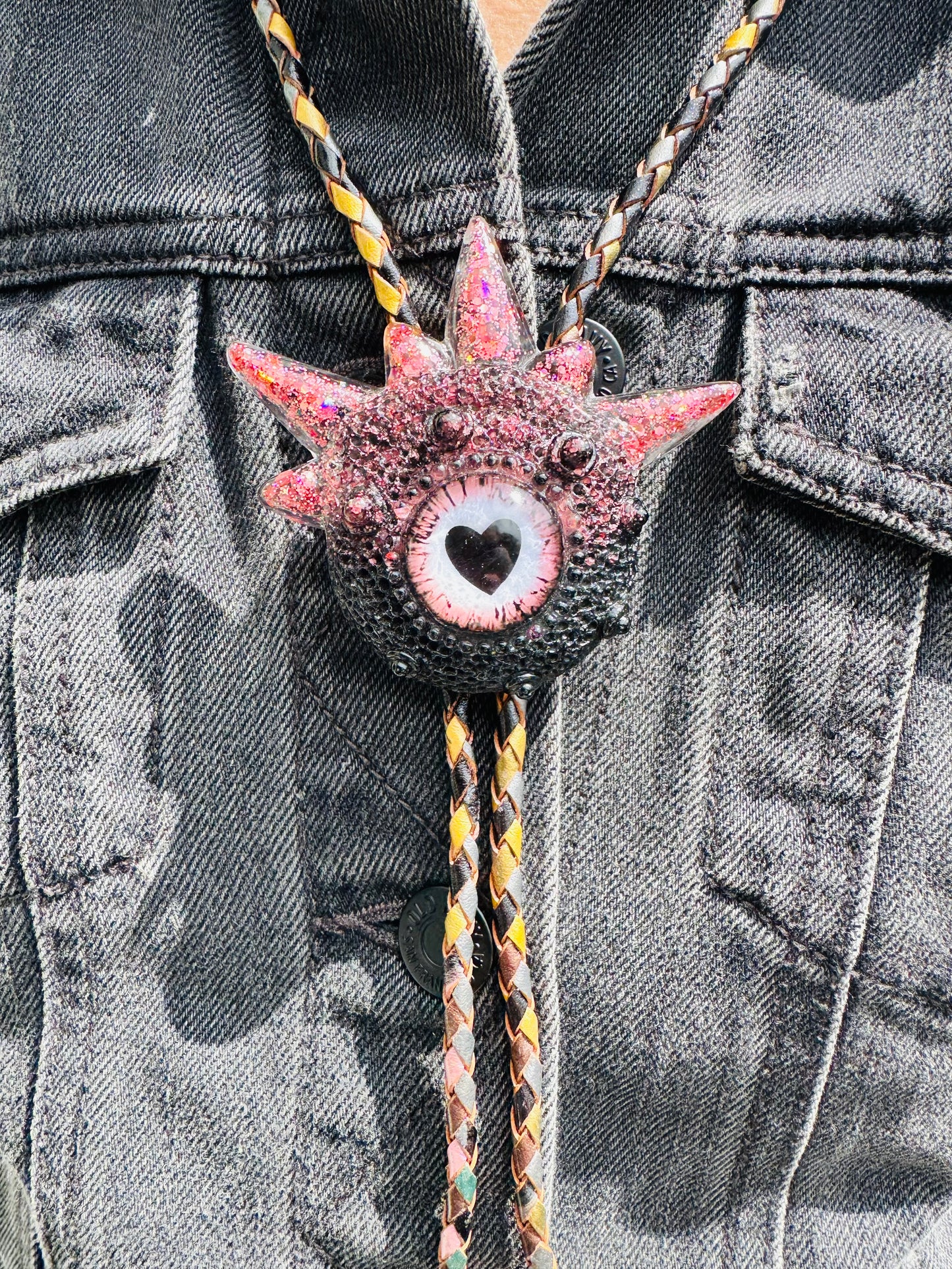 Bolo tie, black and pink monster bolo necktie. Model Spiky.