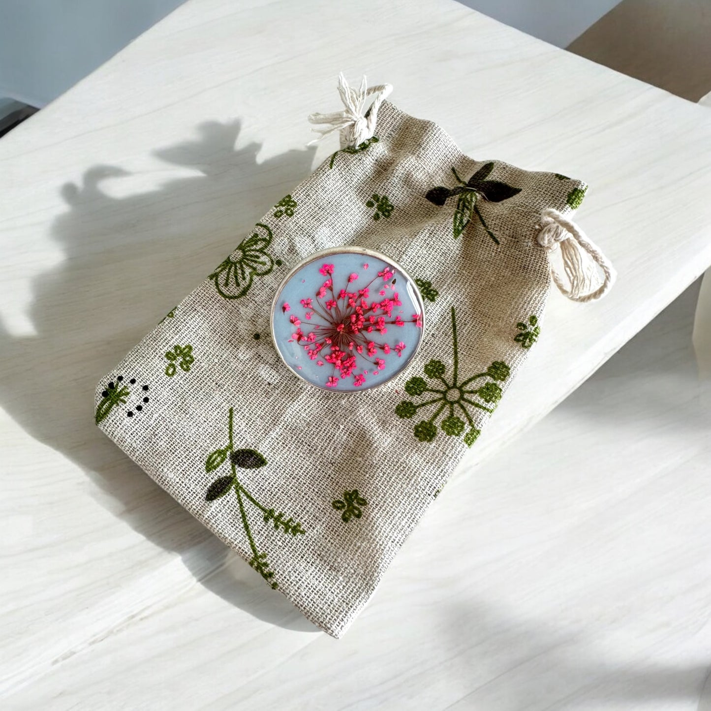 Large round ring with pink flowers