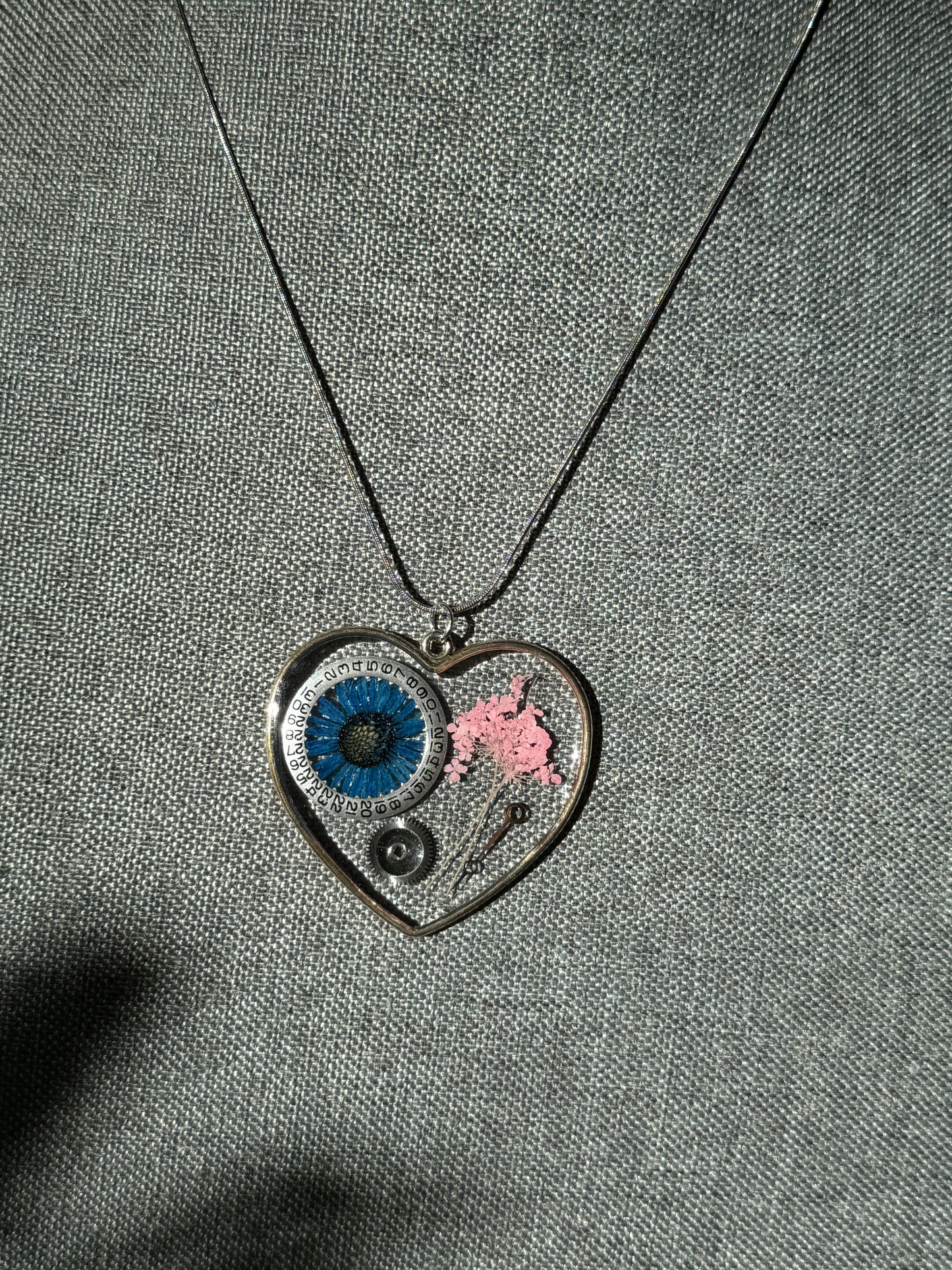 Large heart shape necklace with blue chrysanthemum and watch gear