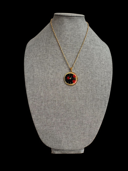 Round necklace with red flowers and watch parts