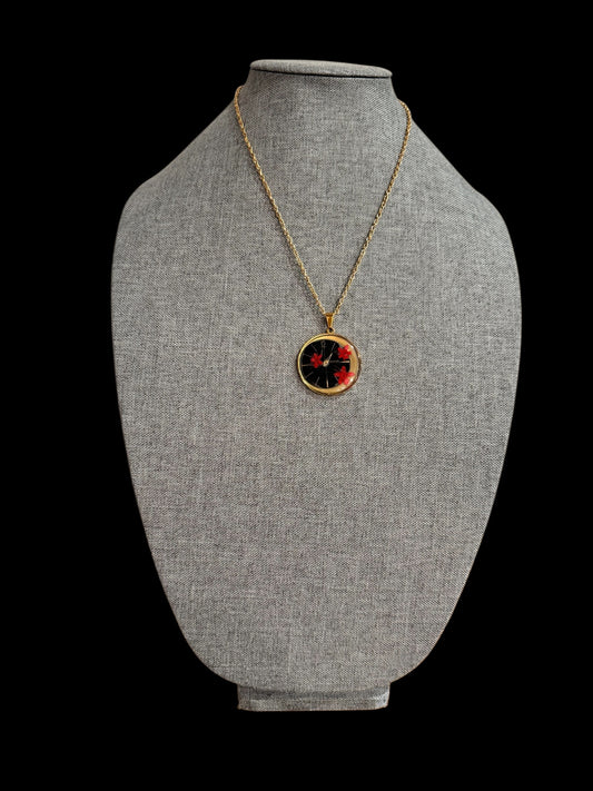 Round necklace with red flowers and watch parts