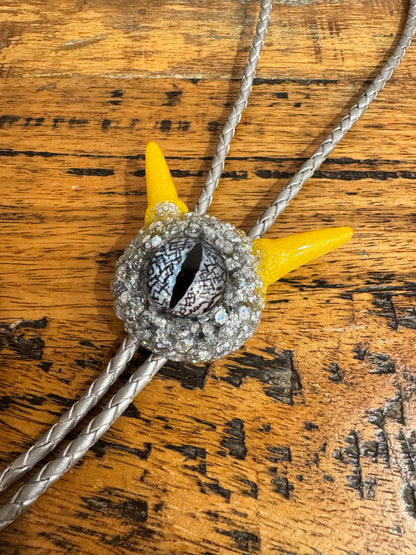 Monster bolo tie in silver and yellow. Model Pointy.