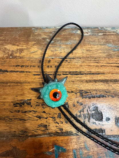 Monster bolo tie in green and black. Model Spiky.