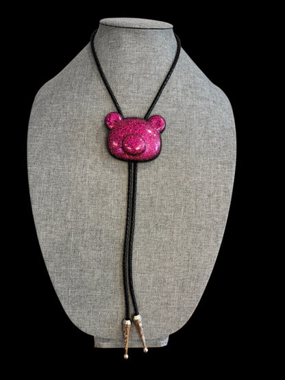 Gummy bear head bolo tie in pink and black.