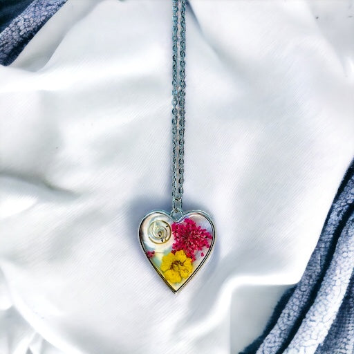 Heart necklace with pink and yellow flowers and watch part