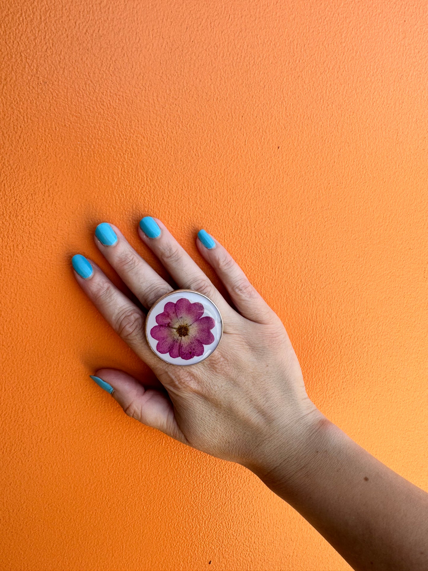 Oversized round silver ring with a rose