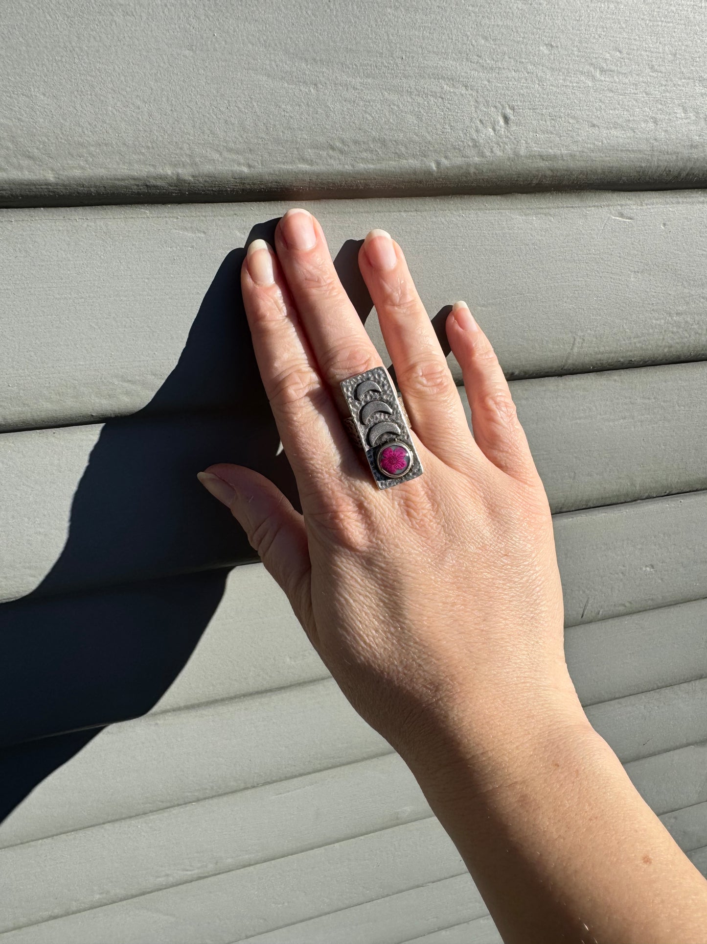 Rectangle ring with pink flower and moon phases design