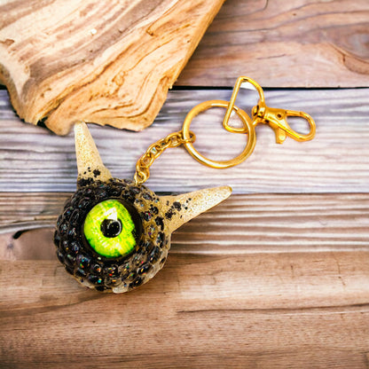 Monster black and gold kawaii keychain. Model Pointy.