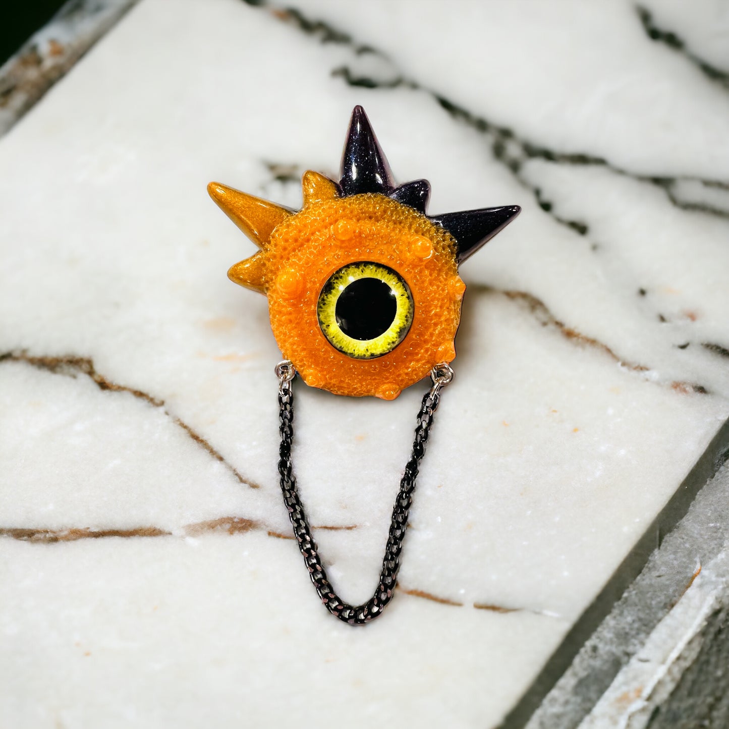 Handmade brooch, orange and black monster brooch, pastel goth jewelry, evil eye brooch in resin,creepy cute,spooky jewelry, kawaii brooch, unique brooch. Model Spiky.