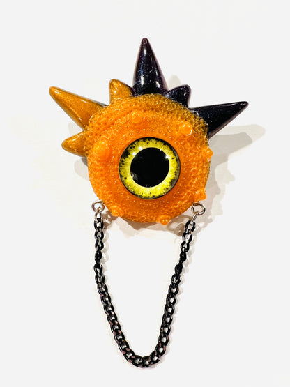 Handmade brooch, orange and black monster brooch, pastel goth jewelry, evil eye brooch in resin,creepy cute,spooky jewelry, kawaii brooch, unique brooch. Model Spiky.