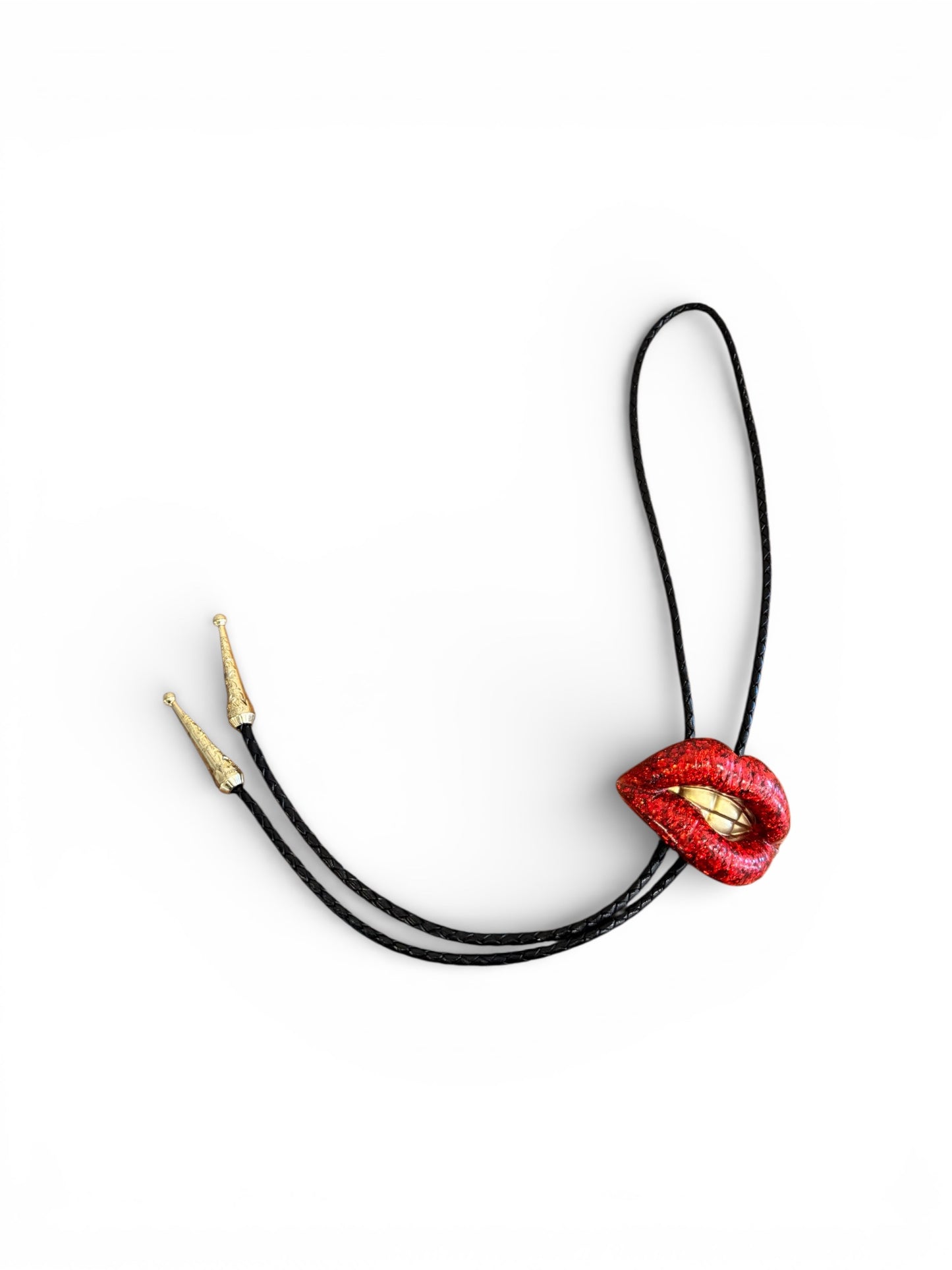 Bolo tie, sparkly red lips with gold teeth