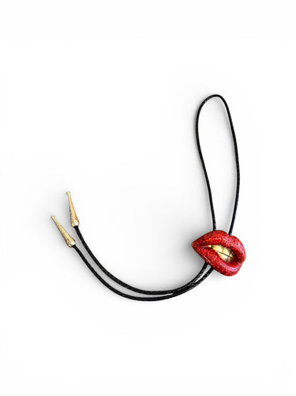 Bolo tie, sparkly red lips with gold teeth