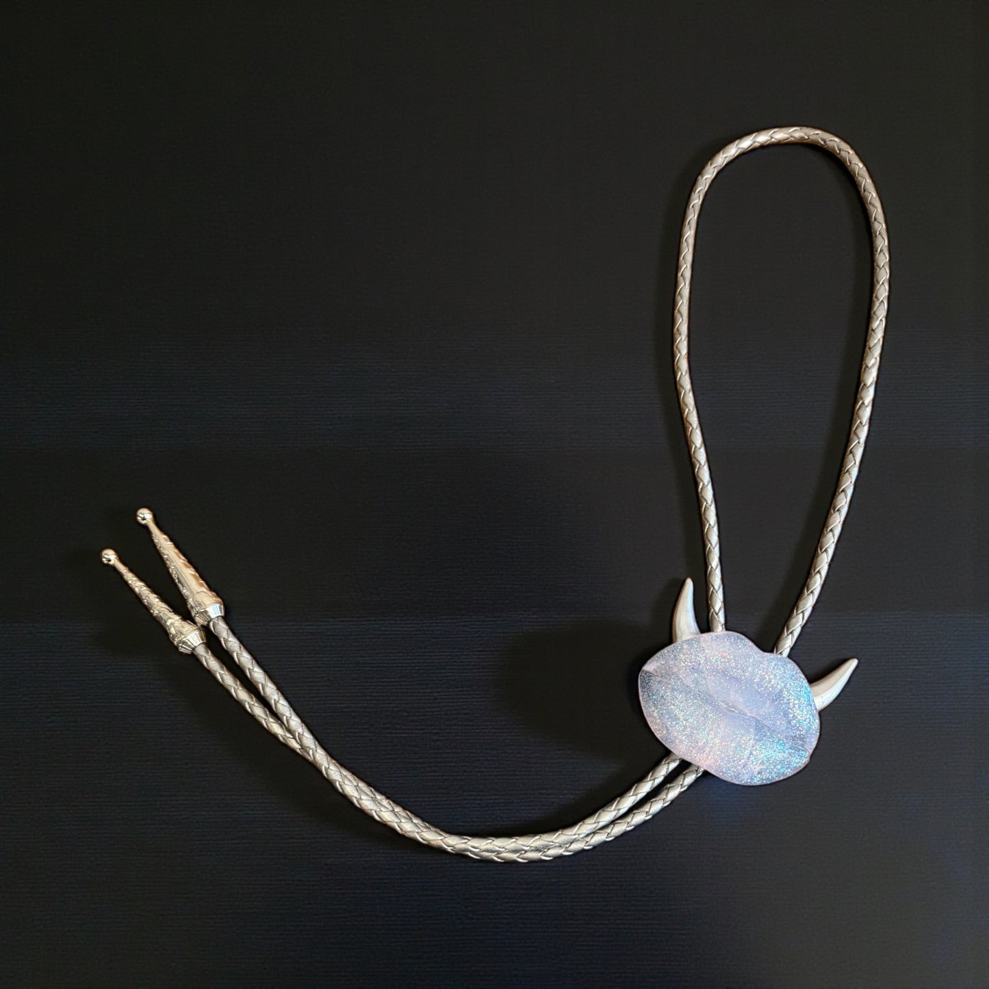 Bolo tie with silver horns, silver clear lips