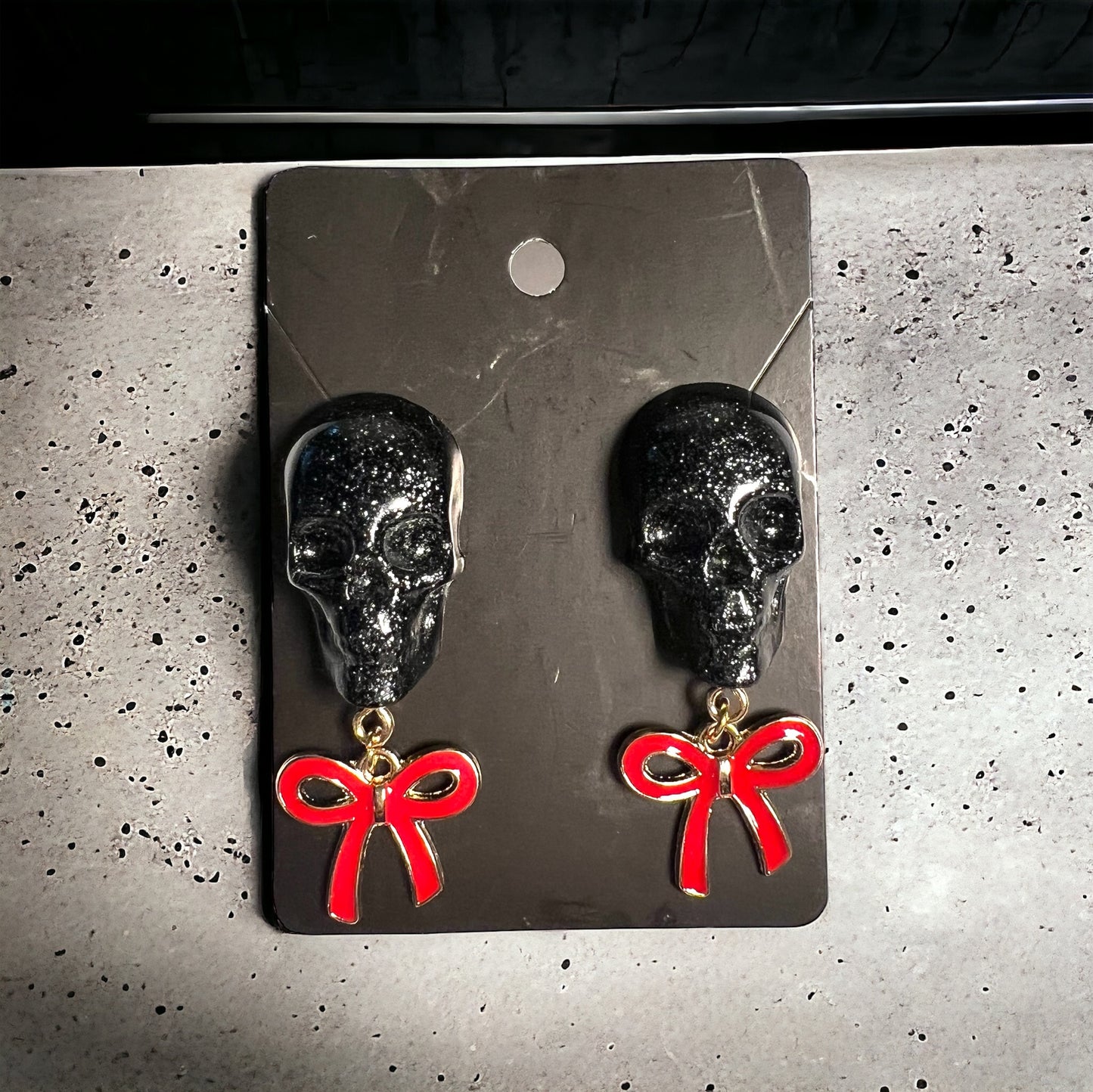 Skull with red bow and gold metal earrings studs