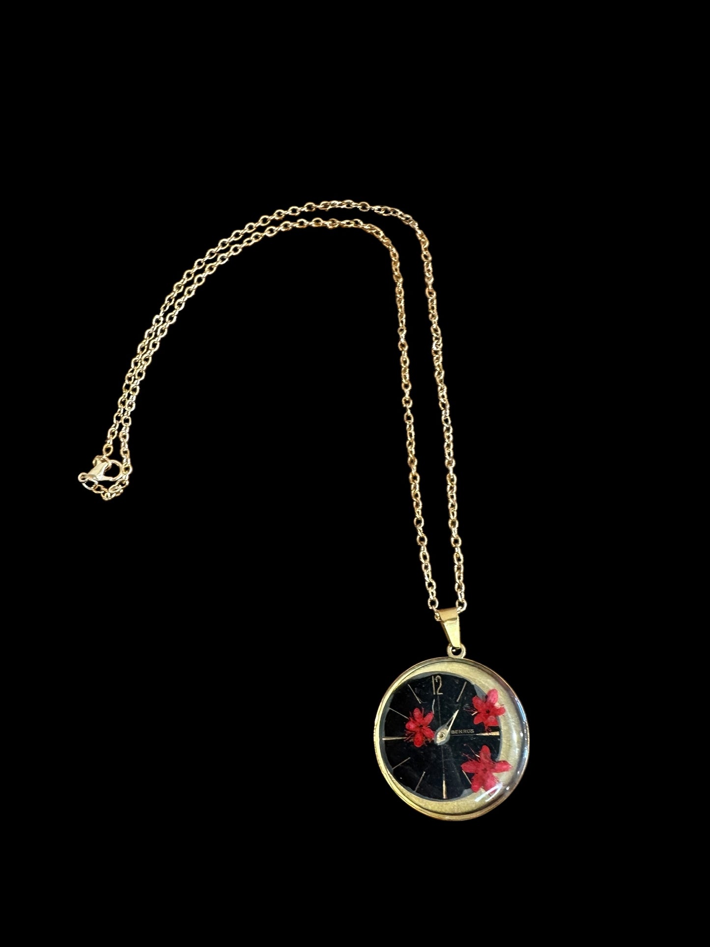 Round necklace with red flowers and watch parts