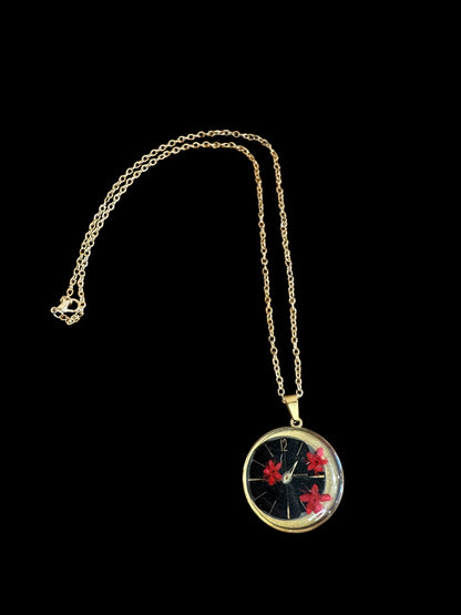 Round necklace with red flowers and watch parts