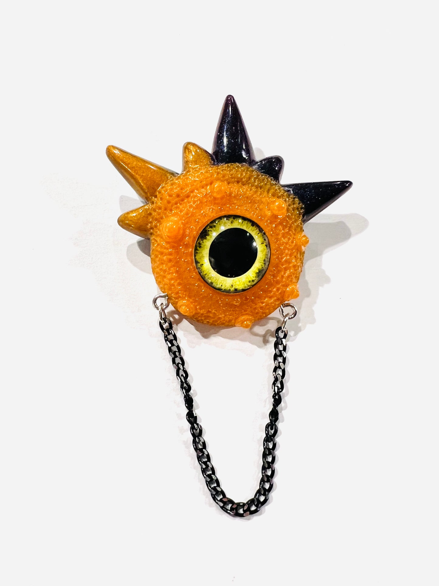 Handmade brooch, orange and black monster brooch, pastel goth jewelry, evil eye brooch in resin,creepy cute,spooky jewelry, kawaii brooch, unique brooch. Model Spiky.