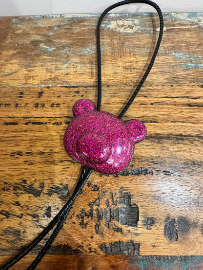 Gummy bear head bolo tie in pink and black.
