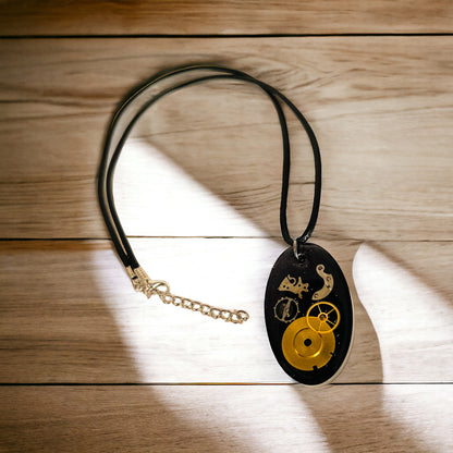 Antiques watch parts oval necklace in black and gold glitter resin