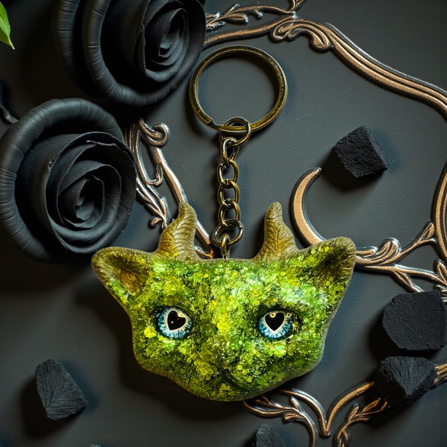 Green cat with gold horns keychain