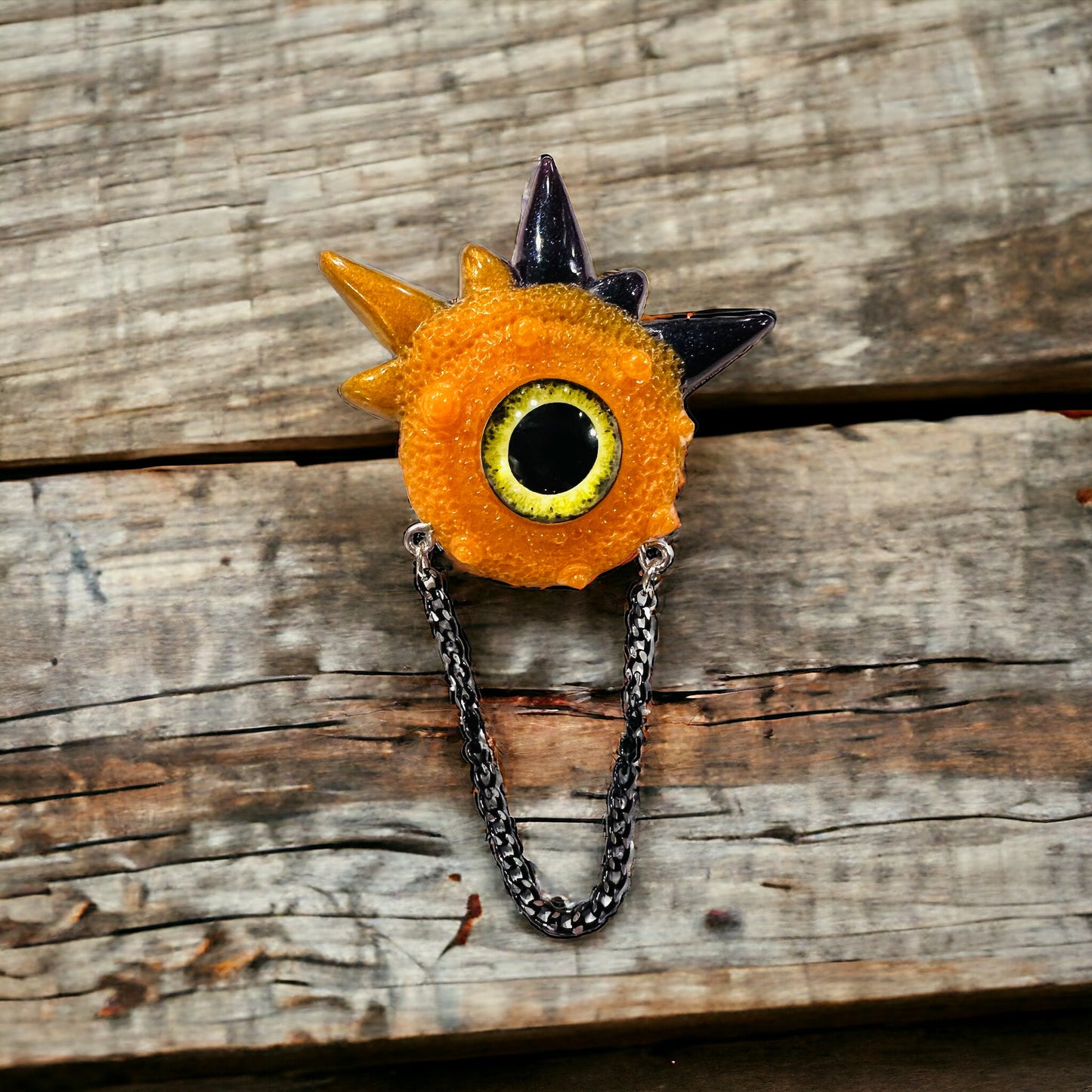 Handmade brooch, orange and black monster brooch, pastel goth jewelry, evil eye brooch in resin,creepy cute,spooky jewelry, kawaii brooch, unique brooch. Model Spiky.