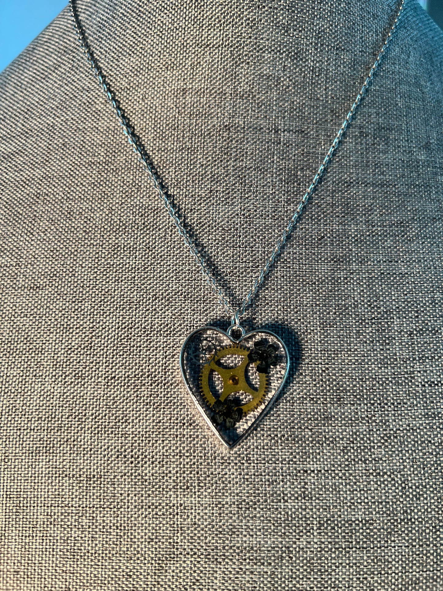 Heart necklace with black flowers and watch parts