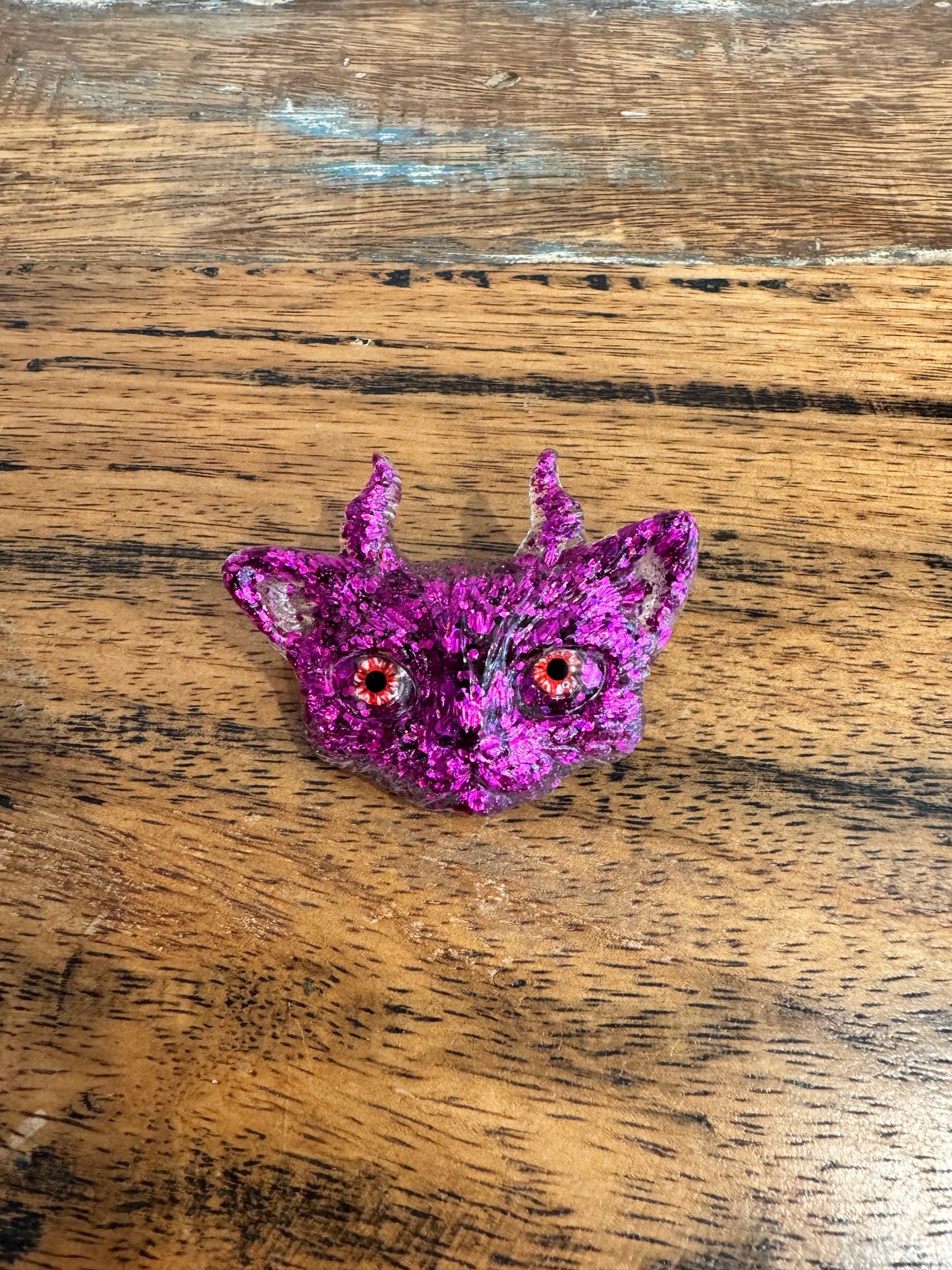 Pink cat brooch with horns