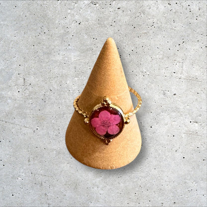 Minimalist gold ring with pink flower