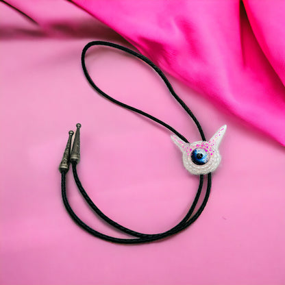 Monster bolo tie in white and pink. Model Pointy.