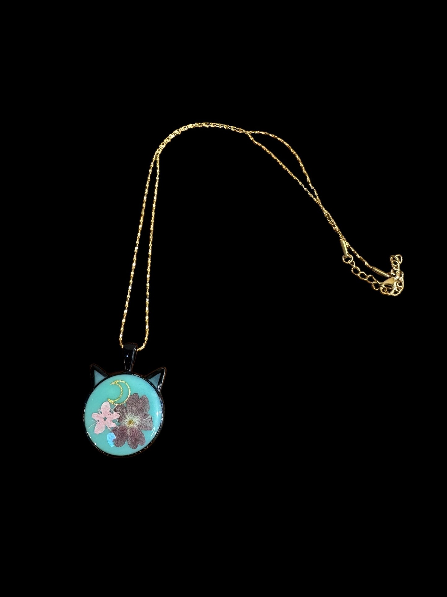 Cat head necklace with pink and purple flowers and moon