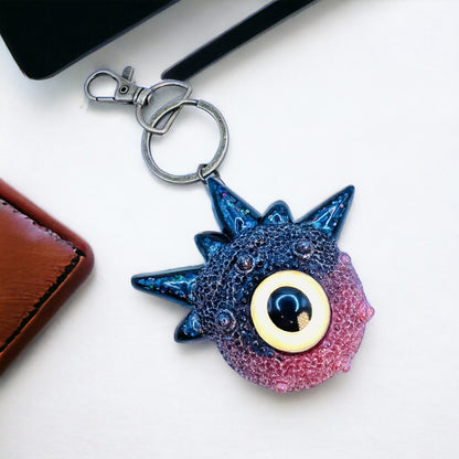 Creepy Monster Eye keychain, black and copper. Model Spiky.