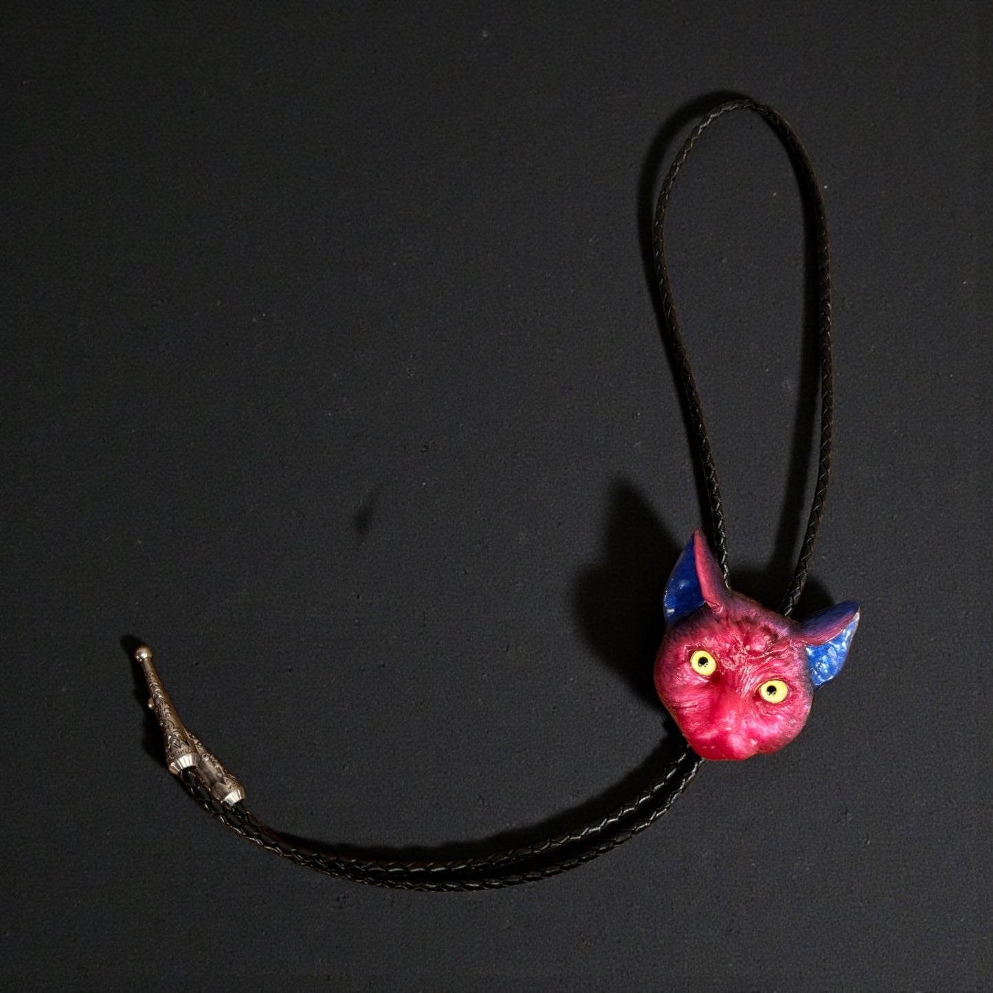 Cat bolo tie in pink and blue.