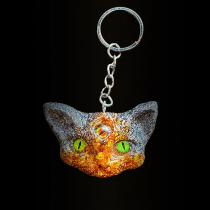 Three eyed cat keychain in orange and black