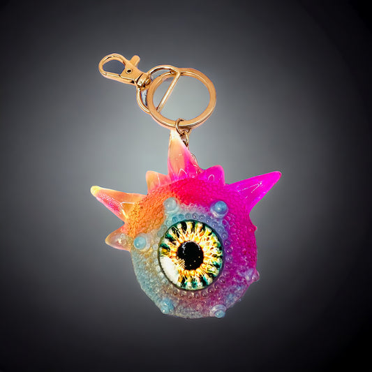Monster keychain, pink,blue and yellow. Model Spiky.