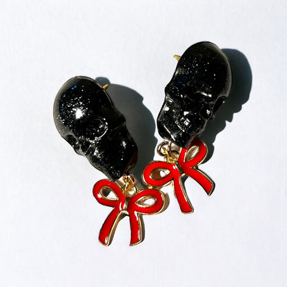 Skull with red bow and gold metal earrings studs