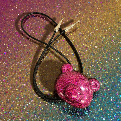 Gummy bear head bolo tie in pink and black.