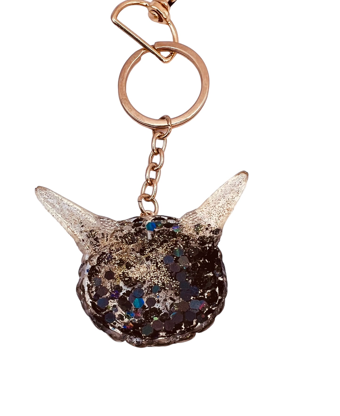 Monster black and gold kawaii keychain. Model Pointy.