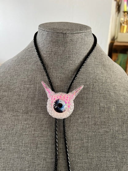 Monster bolo tie in white and pink. Model Pointy.