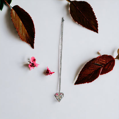 Heart necklace with pink flowers and watch face and gear