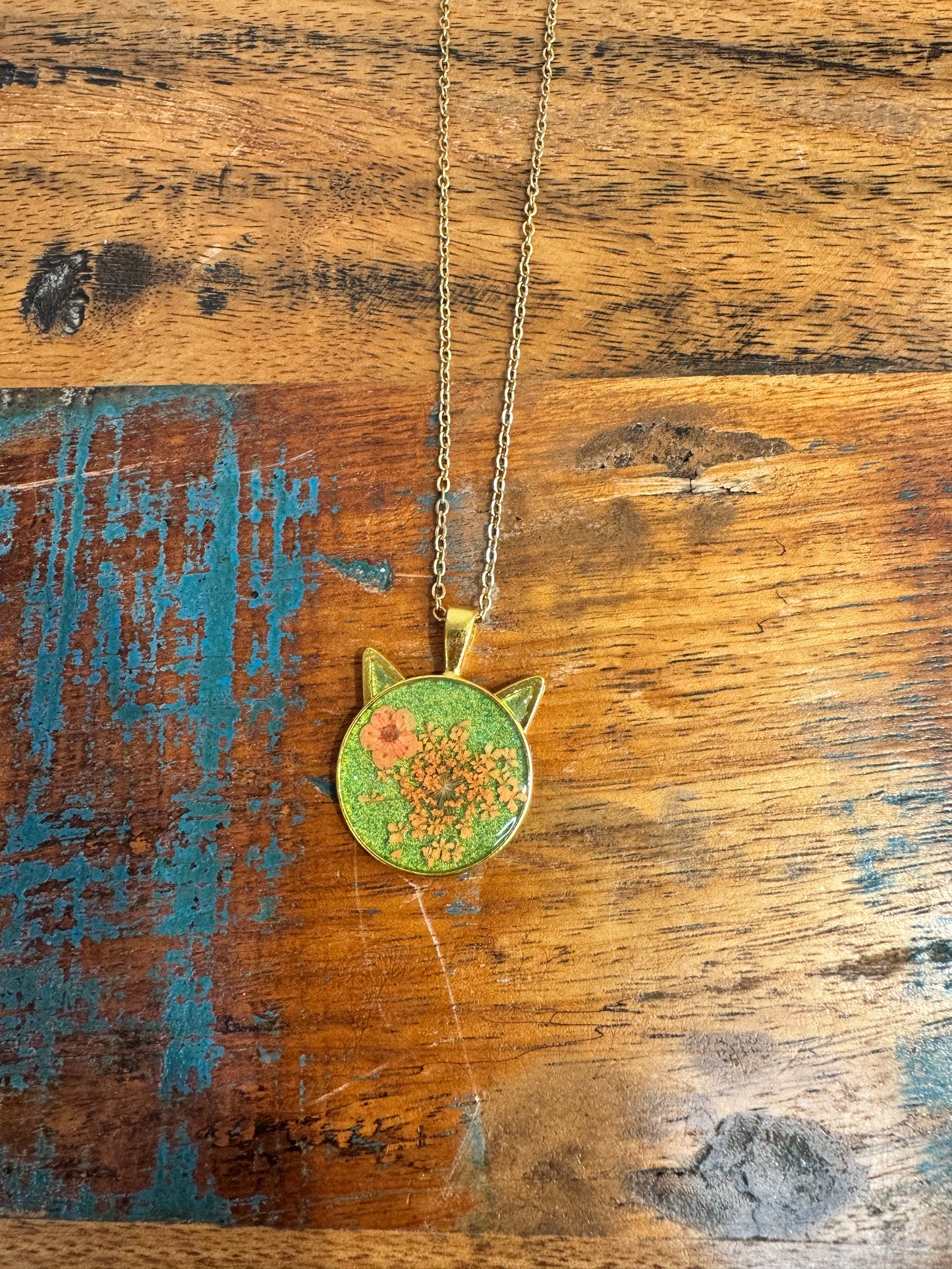 Cat head necklace with orange flowers